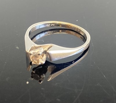 Lot 361 - A white metal diamond solitaire ring, the four-...