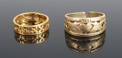 Lot 376 - A yellow metal pierced band ring, unmarked but...