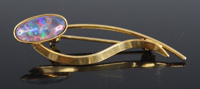 Lot 385 - A silver gilt and opal doublet set bar brooch,...