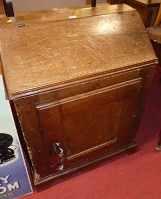 Lot 1198 - An antique joined oak low single door side...