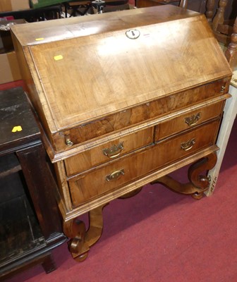 Lot 1204 - A figured walnut cross and feather banded...