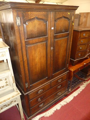 Lot 1208 - A joined oak double door wardrobe, having...