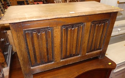 Lot 1212 - A joined oak linenfold three panelled hinge...