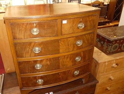 Lot 1216 - A mahogany bowfront chest of two short over...