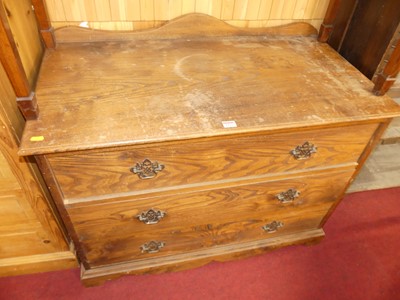 Lot 1222 - An elm squarefront low chest of three long...