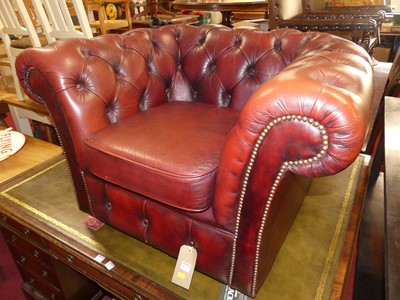 Lot 1242 - A contemporary burgundy leather and brass...