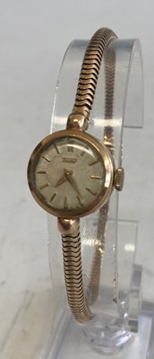 Lot 400 - A Tissot ladies vintage 9ct gold cased wrist...