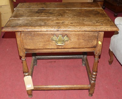 Lot 1282 - An 18th century joined oak plank topped single...