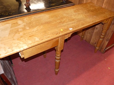 Lot 1291 - A pine long side table, with single end drawer...