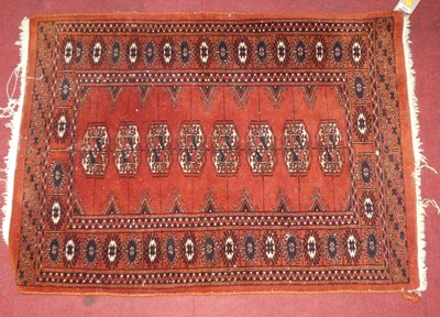 Lot 1296 - A small Persian red ground woollen Bokhara...