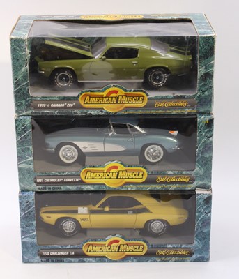 Lot 979 - Three boxed Ertl American Muscle 1/18 scale...