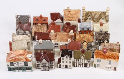 Lot 484 - A collection of pottery house ornaments, to...