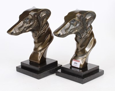 Lot 486 - A pair of reproduction bronze hounds' heads on...