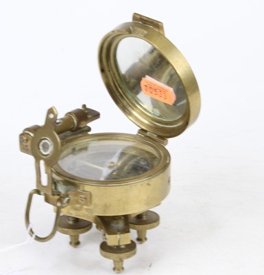 Lot 487 - A reproduction brass desk compass after the...