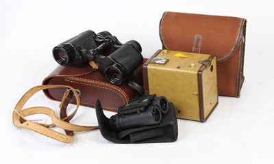 Lot 504 - A cased miniature pair of 8x21 zoom binoculars;...