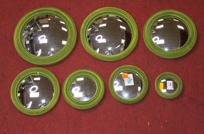 Lot 496 - A collection of seven graduated green velvet...