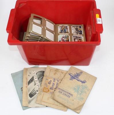 Lot 466 - A collection of cigarette cards housed in...