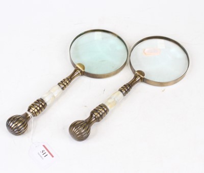 Lot 511 - A pair of gilt metal magnifying glasses, 26cm