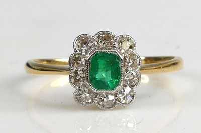 Lot 2571 - A yellow and white metal, emerald and diamond...