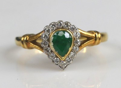 Lot 2572 - An 18ct yellow and white gold, emerald and...