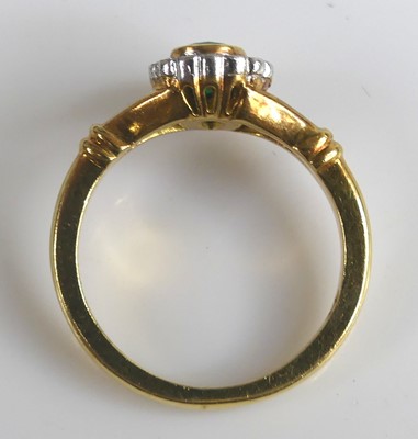 Lot 2572 - An 18ct yellow and white gold, emerald and...