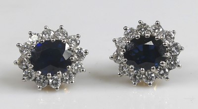 Lot 2574 - A pair of 18th yellow and white gold, sapphire...