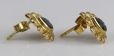 Lot 2576 - A pair of yellow metal sapphire and diamond...