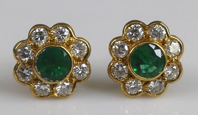 Lot 2577 - A pair of 18ct yellow gold emerald and diamond...