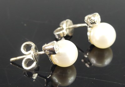 Lot 2579 - A pair of white metal pearl and diamond stud...