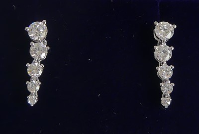 Lot 2601 - A pair of 18ct white gold diamond drop...