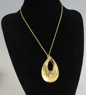 Lot 453 - A drop shaped Murano glass pendant, with gold...