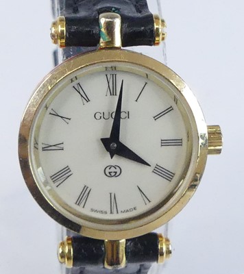 Lot 2633 - A lady's Gucci gold plated quartz dress watch,...
