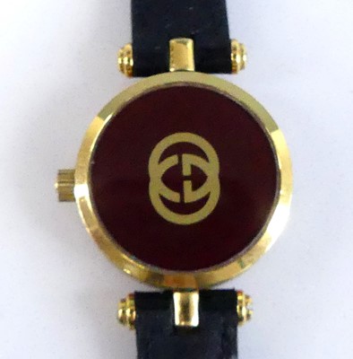 Lot 2633 - A lady's Gucci gold plated quartz dress watch,...