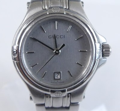 Lot 2636 - A Gucci lady's steel cased quartz dress watch,...