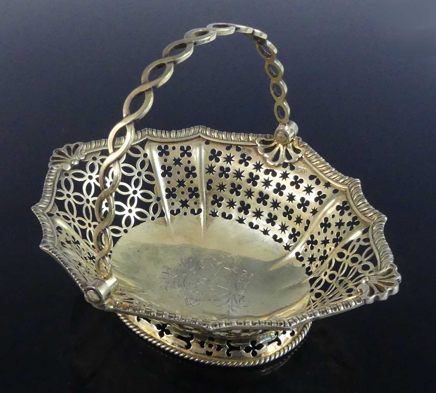 Lot 2071 - A late 18th century silver-gilt swing handle...