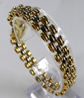 Lot 2673 - A lady's bi-colour 18ct gold bracelet, as...