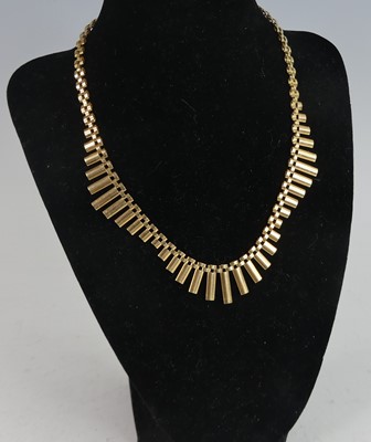 Lot 2679 - A modern 9ct gold necklace, having textured...