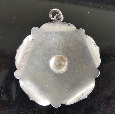 Lot 2596 - A continental silver flower head pendant,...