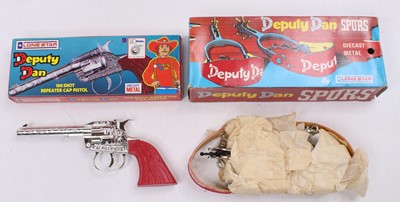 Lot 1878 - A Lonestar Deputy Dan boxed cap gun and spurs...