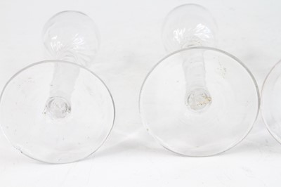 Lot 2051 - A pair of wine glasses, circa 1770, the basal...