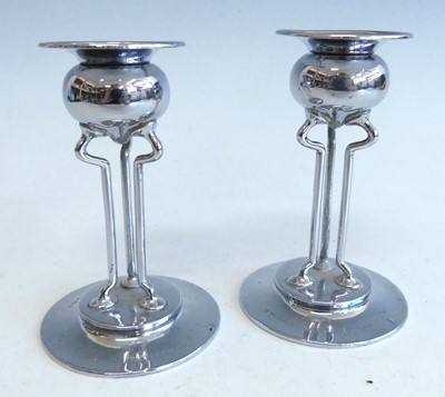 Lot 570 - A pair of Art Nouveau silver candlesticks,...