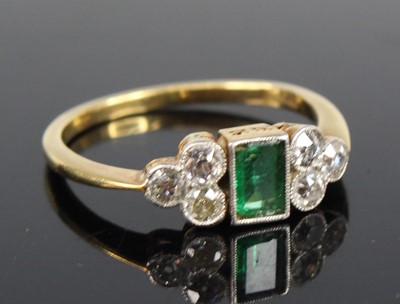 Lot 2698 - A yellow metal, emerald and diamond ring,...