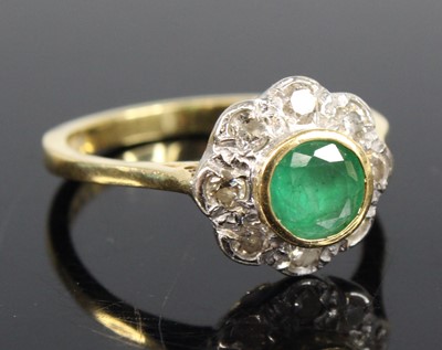 Lot 2700 - An 18ct yellow and white gold, emerald and...