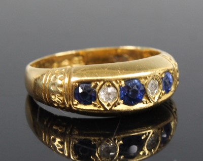 Lot 2703 - An 18ct yellow gold, sapphire and diamond half...