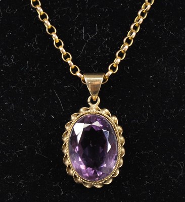 Lot 2706 - A 9ct yellow gold amethyst pendant, featuring...