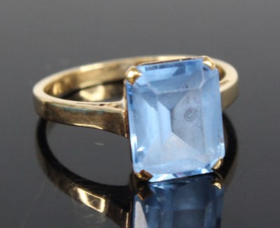 Lot 2707 - A yellow metal synthetic spinel single stone...