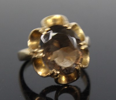 Lot 2708 - A yellow metal smoky quartz dress ring,...