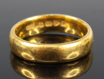 Lot 2717 - A 22ct gold court shaped wedding band, sponsor...