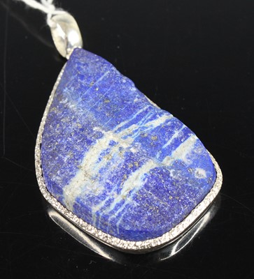 Lot 2743 - A contemporary silver and lapis lazuli pendant,...