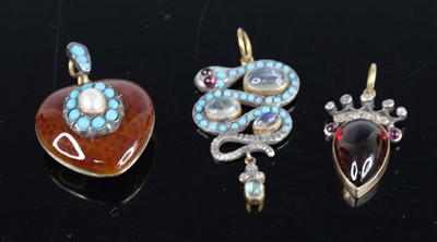 Lot 2759 - Three assorted pendants to include a yellow...